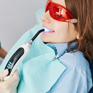 Dentist performing composite bonding at Wrexham practice