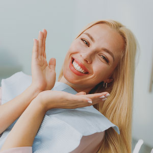 Female with new porcelain veneers at Wrexham dentist